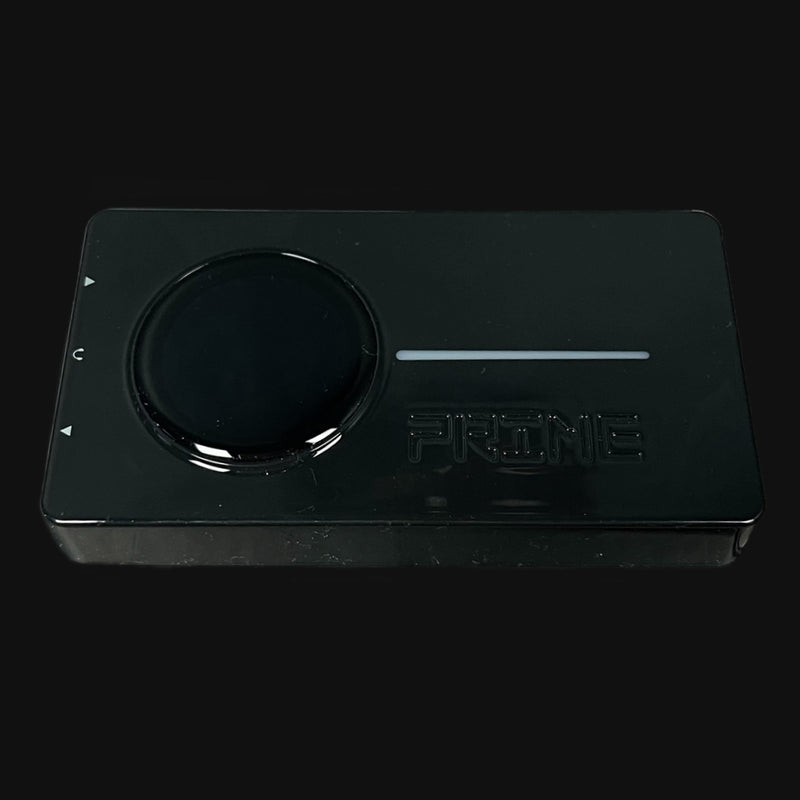 Black electronic device with a circular component and 'PRIME' branding on a black background