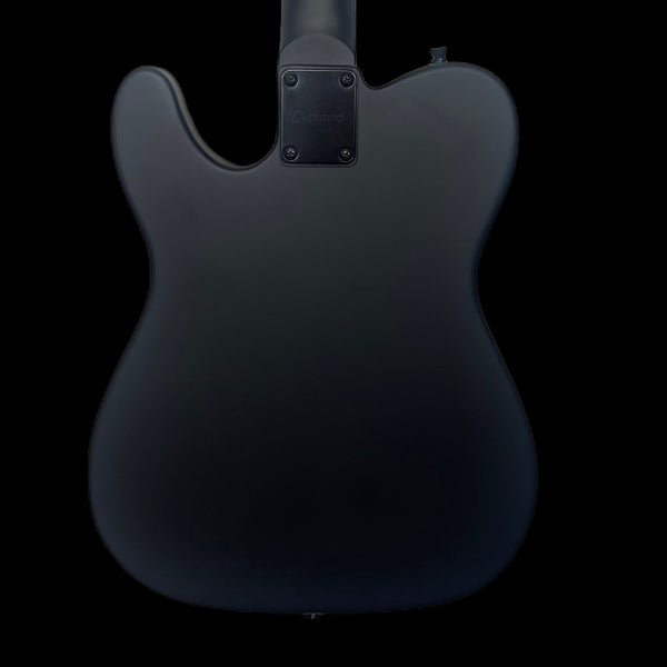 The back of a completely matt black telecaster shaped guitar